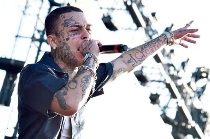 Unmasking the Phenomenon: The White Rapper with Tattoos on His Face